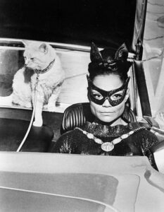 Eartha Kitt as Catwoman with a cat on a leash